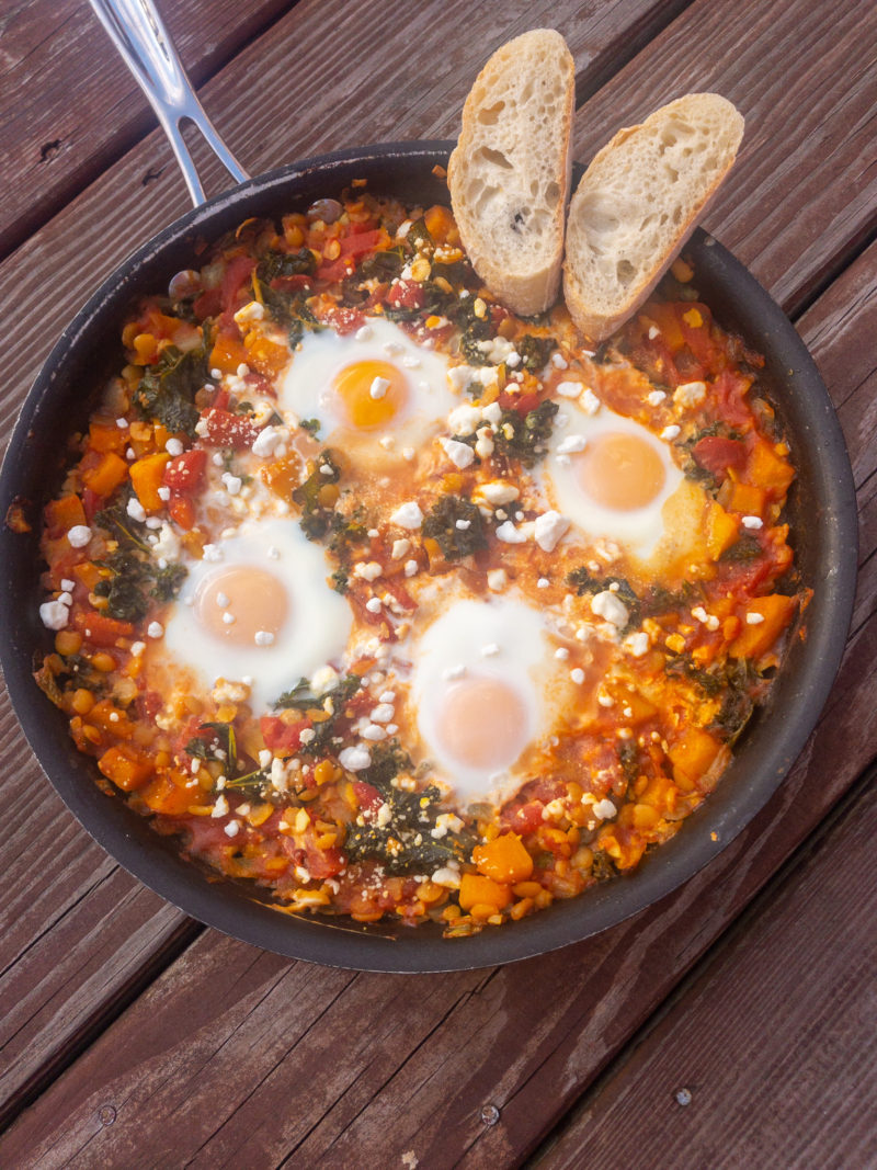 Baked Eggs with Butternut Squash, Kale, Split Peas, and Goat Cheese